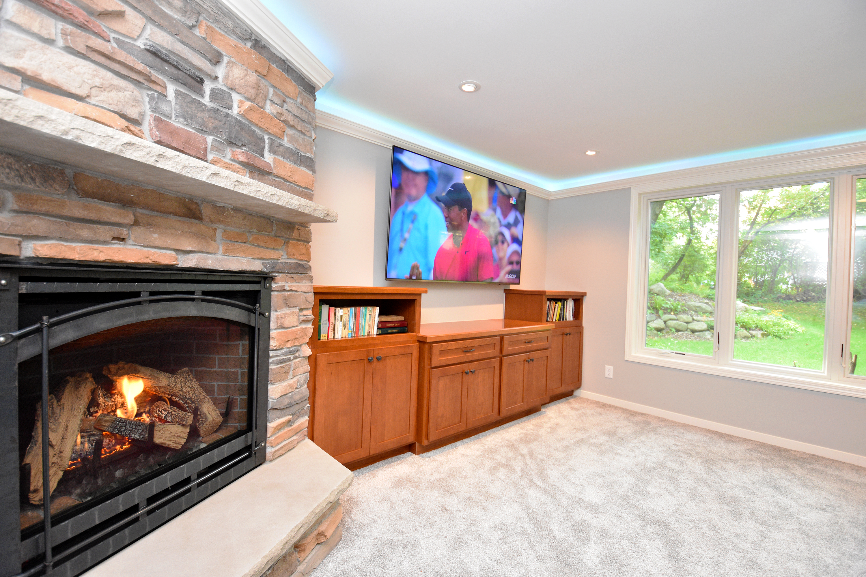 Basement remodel - view of fireplace and TV