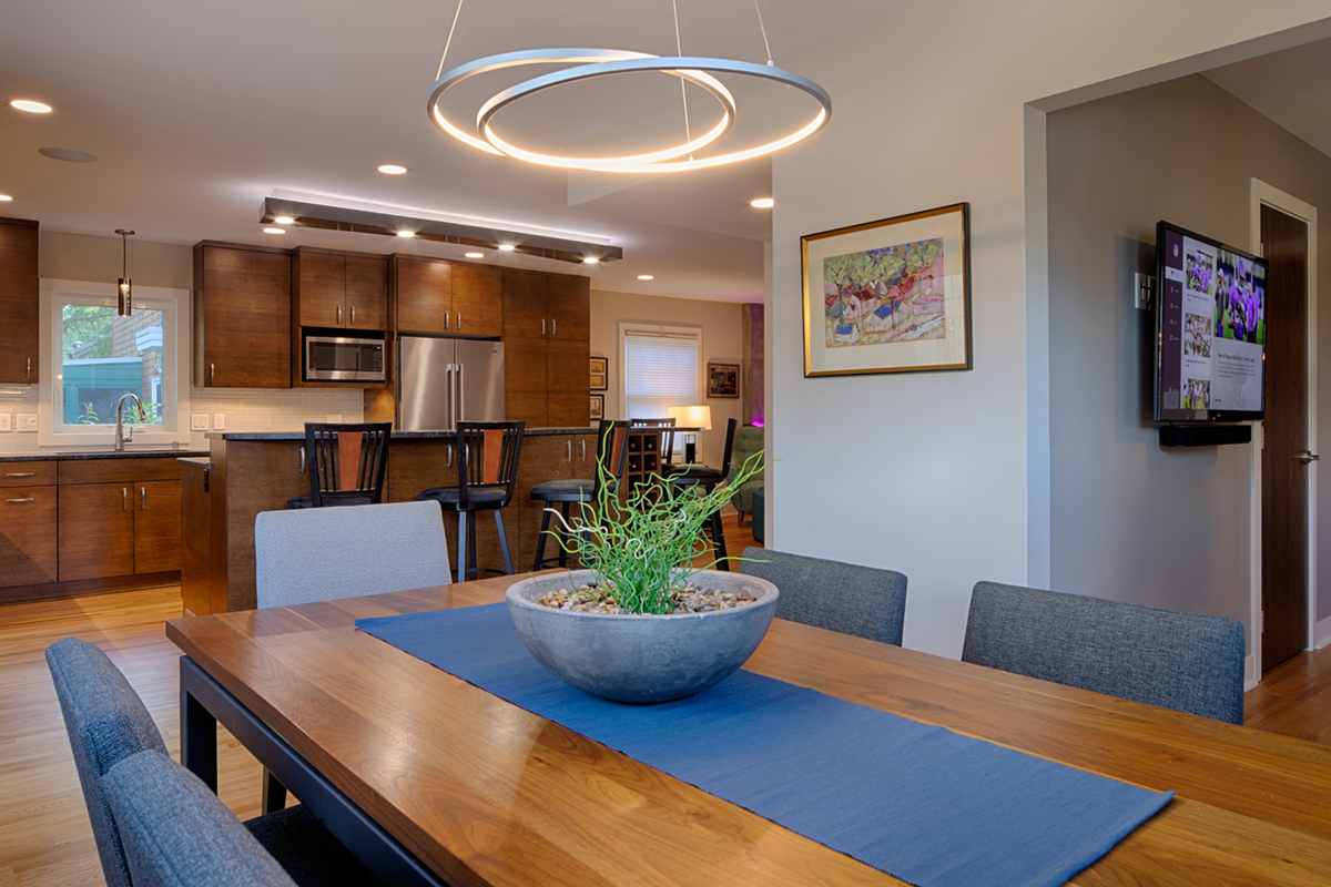 Modern dining room with unique lighting fixture