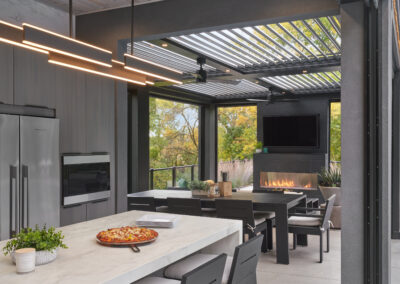 Contemporary outdoor kitchen - part of poolhouse project - Louvers open.