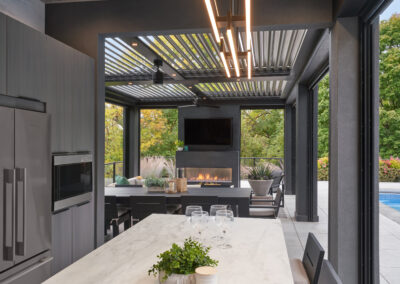 Contemporary outdoor kitchen - part of poolhouse project - Screens open.