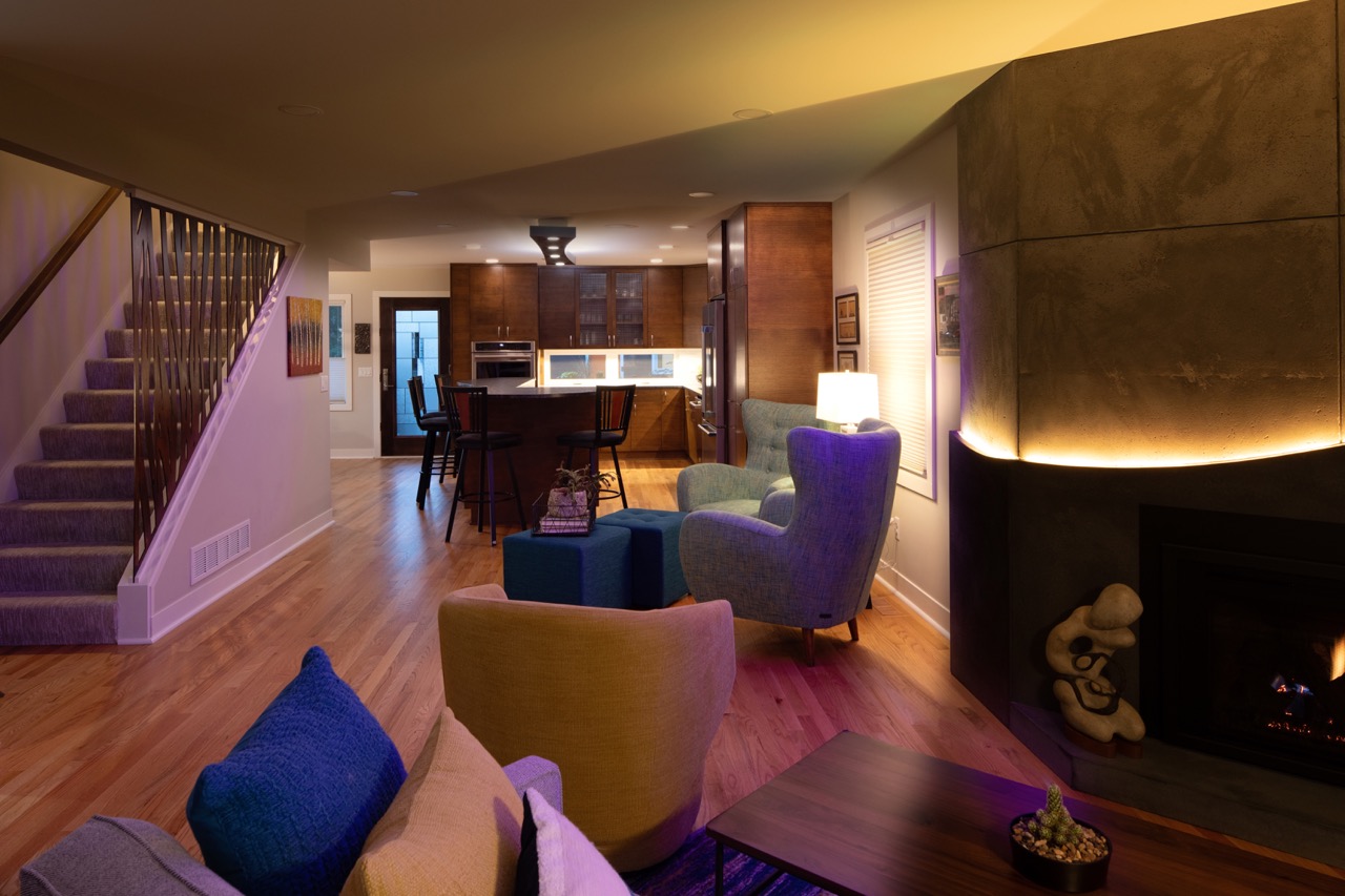 Midcentury Makeover - Illuminated Living Room - Custom Fireplace & yellow LED lighting