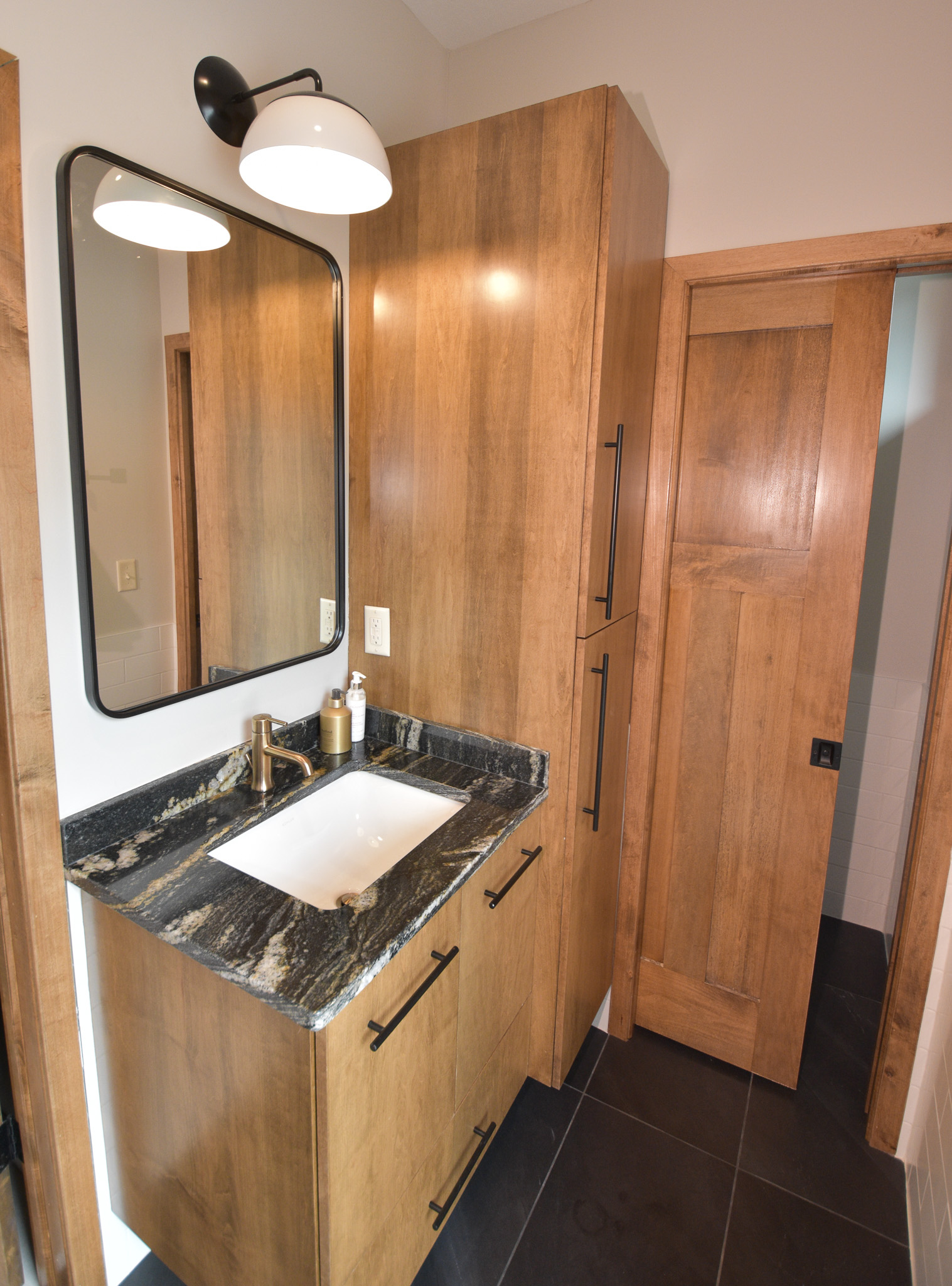 Contemporary Living - Kids Bath - Single vanity with wood cabinetry - pocket door